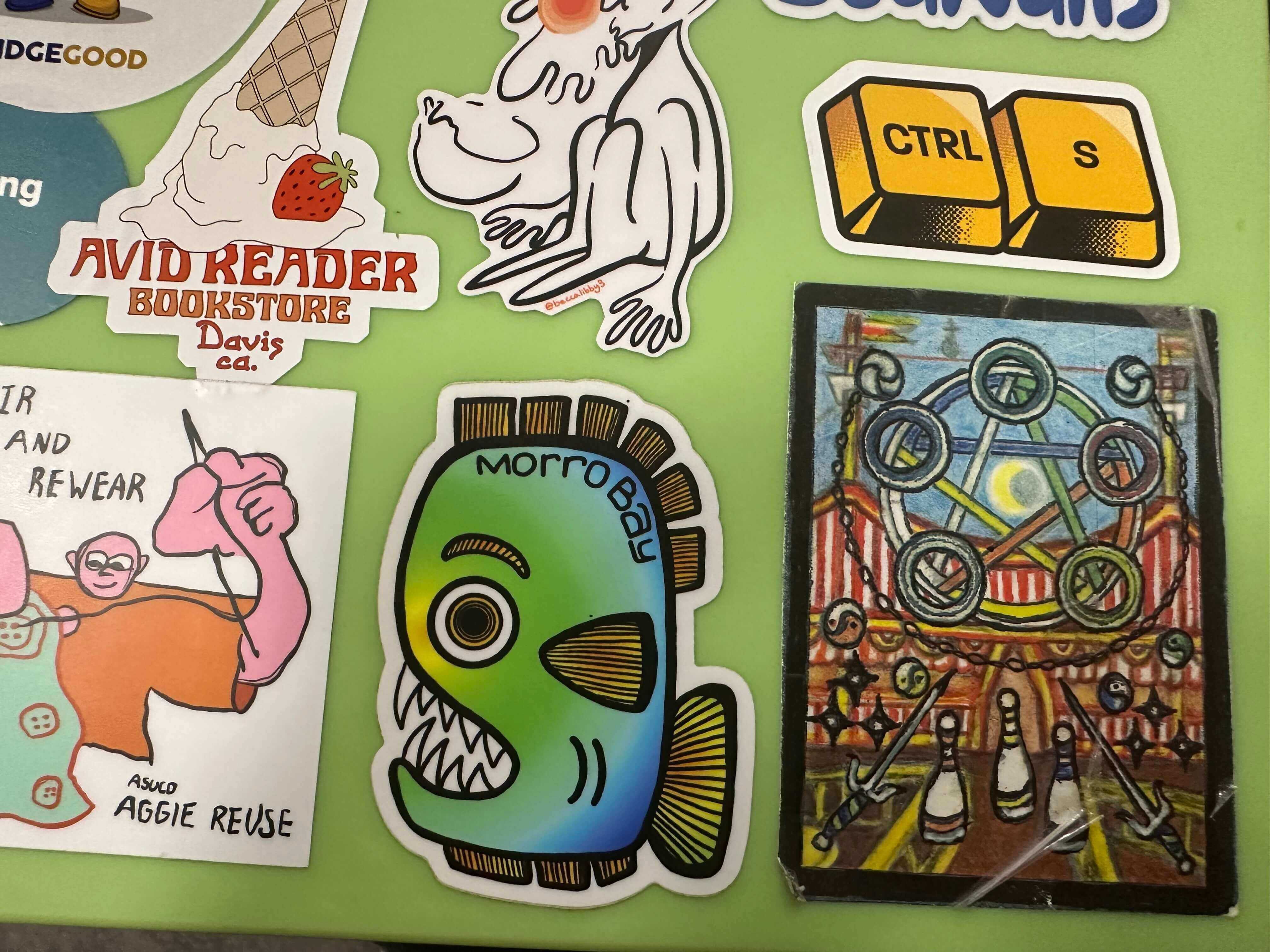 A laptop covered with colorful stickers